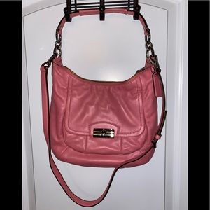 Coach handbag with removable strap.